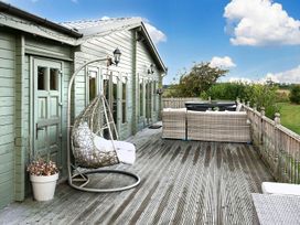 An outdoor space with a hanging chair and sofa at the property in unspecified location