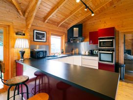 A kitchen with appliances and a bar stool at the property in location