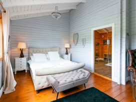 A bedroom with a bed and nightstand at the property in the location