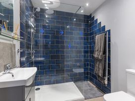 A bathroom with shower, sink, toilet and towel rack at 1Bed Coastal Retreat Sleeps 2 Parking Wifi Bude