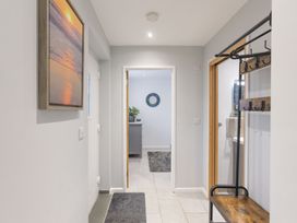 A hallway with a coat rack and a picture frame at 1Bed Coastal Retreat Sleeps 2 Parking Wifi Bude