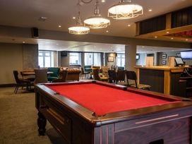 A game room with a pool table and seating areas at 2Br Lodge Pool Fireplace PetsOK Parking Goonhavern