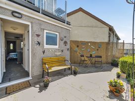 An outdoor seating area with a table and chairs at Studio Sleeps 2 with Parking and Garden Trewidland near Liskeard