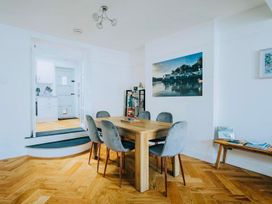 A dining room with a table and chairs at The Slipway Fowey Harbour with Garden in Fowey