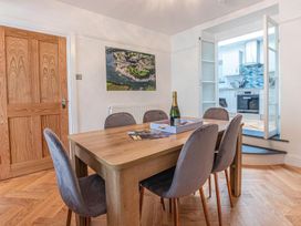 A dining room with a table and chairs at The Slipway Fowey Harbour with Garden Fowey