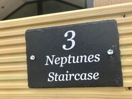 A sign displaying number 3 and the name Neptunes Staircase