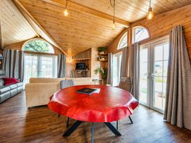 A living room with a dining table and sofa at Alpaca Farm Valley Views Sleeps 4 Parking Pets in Husthwaite