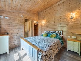 A bedroom with a bed and chest of drawers at Alpaca Farm Valley Views Sleeps 4 Parking Pets in Husthwaite