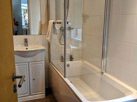 A bathroom with a bathtub and sink at Felmoor Park Northumberland Lodge with Hot Tub, Felmoor Park near Felton