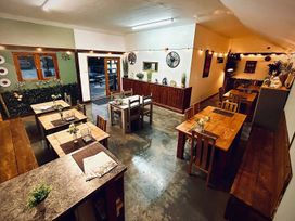 A dining room with tables and chairs at 1Bed pod cabin in beautiful surroundings Wrexham