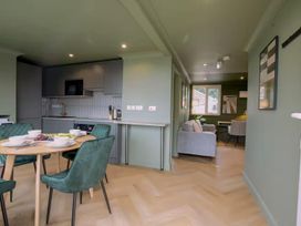 A kitchen and living area with a table and chairs at 1 Bedroom Apartment Sleeps 2 Pets Welcome in Carbis Bay