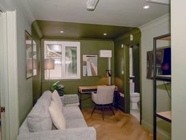 A living room with a sofa, desk, and television at 1 Bedroom Apartment Sleeps 2 Pets Welcome in Carbis Bay