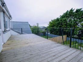 A deck with railing and trees at 1 Bedroom Apartment Sleeps 2 Pets Welcome Carbis Bay