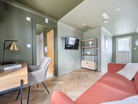 A living room with a sofa and television in 1 Bedroom Apartment Sleeps 2 Pets Welcome in Carbis Bay