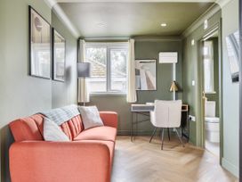 A living room with a sofa and desk at 1 Bedroom Apartment Sleeps 2 Pets Welcome in Carbis Bay