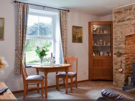 A dining area with table and chairs at the property in an unspecified location