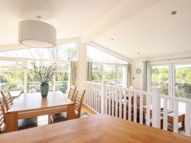 A dining room with a table and chairs at 4 Tree Tops in Liskeard