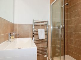 A bathroom with a sink and shower at 4 Tree Tops in Liskeard