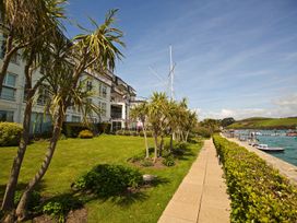 An outdoor area with grass, plants, and a building at 4 The Salcombe, Salcombe