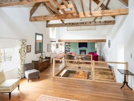 A living room with beams and furniture at French Mill in Shaftesbury