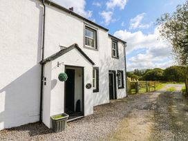An exterior view of a house with a gravel pathway at Bramble near Cleator Moor
