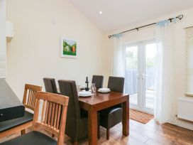 A dining room with a table set for a meal at Bramble near Cleator Moor