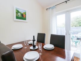 A dining room with a table set for dinner at Bramble near Cleator Moor