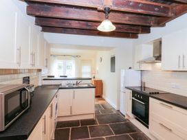 A kitchen with a refrigerator and oven at Bramble near Cleator Moor