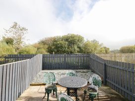 A garden area with a table and chairs at Bramble near Cleator Moor