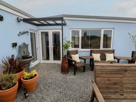 An outdoor area with seating and a fountain at The Hideaway at Monterey Helston