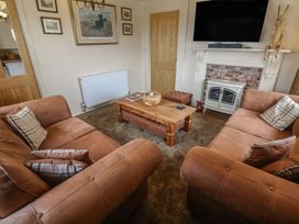 A living room with sofas and a coffee table at The Hideaway at Monterey Helston
