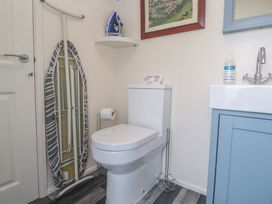 A bathroom with a toilet and sink at The Hideaway at Monterey Helston