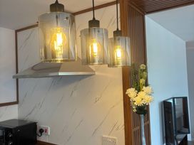 A kitchen with lighting and microwave at Truly Scrumptious in Yarm