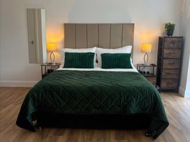 A bedroom with a bed and bedside tables at Truly Scrumptious in Yarm