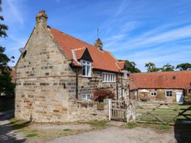 A house with a garden and gate at Farmhouse in Whitby