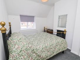 A bedroom with a bed and a window at the Farmhouse in Whitby