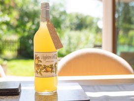 A bottle of apple juice on a table at Oak Lodge