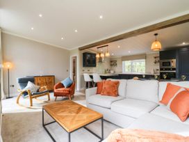 A living room with a sofa and coffee table at Cherry Lodge Battisford near Stowmarket