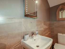 A bathroom with a sink and toilet at 1 Grenville Road in Truro