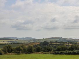 A landscape view with hills and fields at Wilpol in Llanerchymedd
