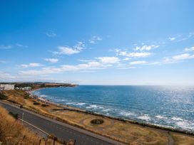 A view of the ocean and road at The Gulls Rest