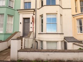 A front entrance with steps and windows at The Gulls Rest 