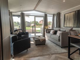 A living room with sofas and a coffee table at Lakewood Plot 4 St. Osyth