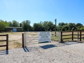 An outdoor area with a gate and sign at Lakewood Plot 5 in St. Osyth