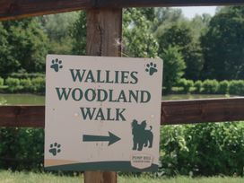 A sign for Wallies Woodland Walk at Pump Hill Caravan Park
