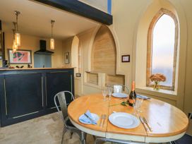 A dining room with a table set for a meal at The Sunday School Room Sherborne