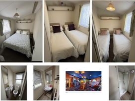 A bedroom with beds and a bathroom at Golden Sands Holiday Park in Dawlish
