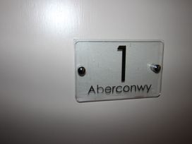 A nameplate with the number 1 and the word Aberconwy