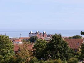 A view of buildings and ocean at 26 Metropole Towers in Whitby