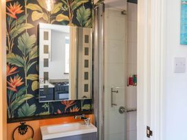 A bathroom with a sink and shower at Little Moorgate in Okehampton